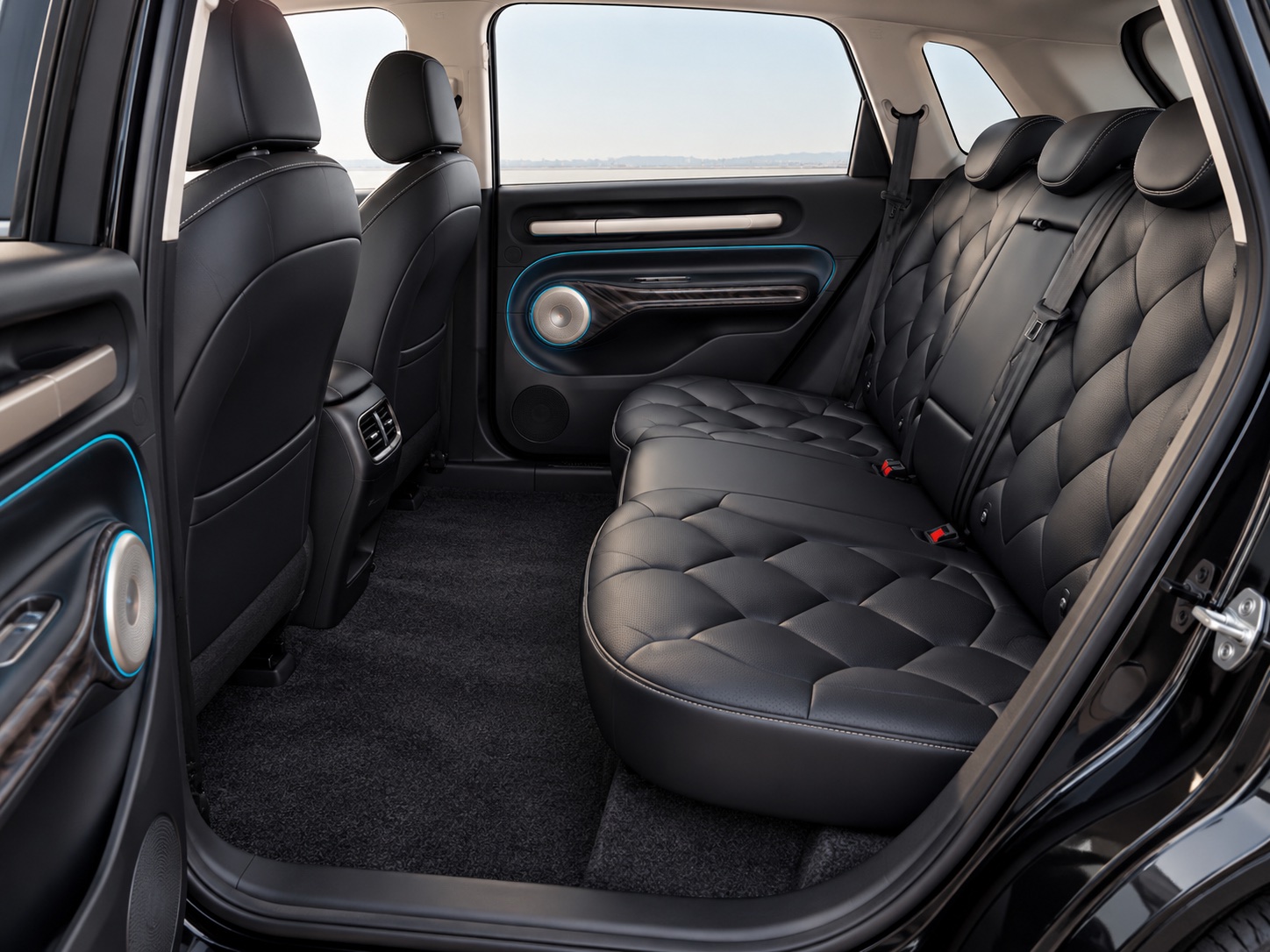 Illustration of a black quilted rear seat and the open legroom between the bench and front seats